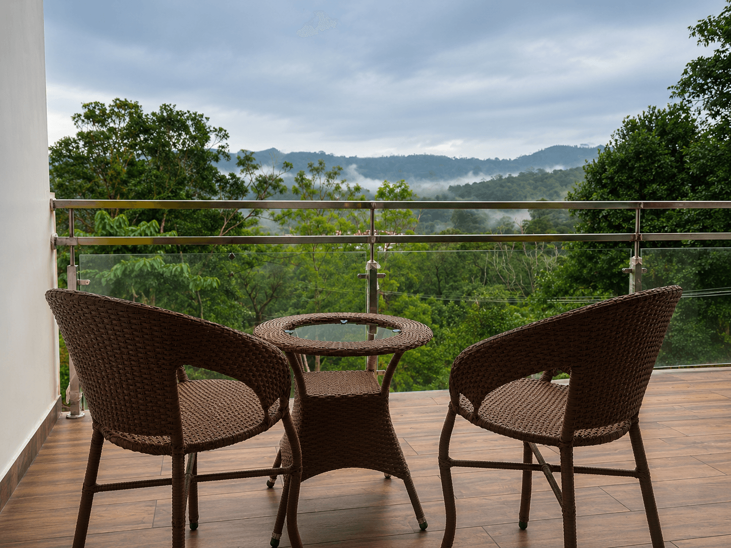 Seating on a balcony overlooking misty hills