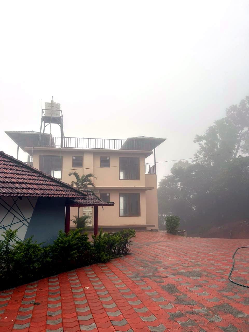 Property surrounded by morning mist
