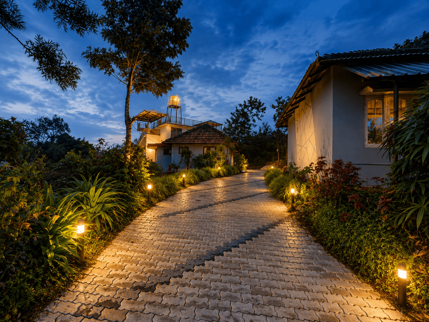 Lit pathway leading to the homestay at twilight